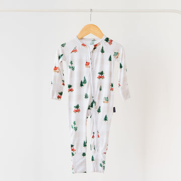 Floral-patterned baby onesie on a hanger against a white background